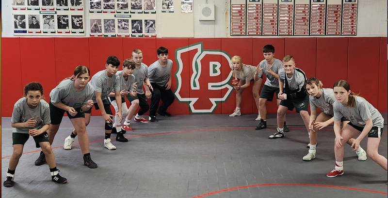 The L-P Crunching Cavs are sending a group of wrestlers to the Illinois Kids Wrestling Federation state tournament this weekend. Pictured (from left) are Sophia Smith (Intermediate division, 72 pounds), Collins Miller (Intermediate, 135), Jake Kasprak (Novice, 93), Brody Sliker (Senior, 84), Aiden Urbanc (Novice, 134), Karson Kelly (Senior, 188), Audriana Plut (Senior, 145), Thomas Hughes (Novice, 125), Brycen Miller (Novice, 125), Stephanie Hawkins (Novice, 102) and Isabella Grisham (Novice, 90). Collins Miller, Hawkins and Plut were sectional champions, while Plut, Urbanc, Kelly, Hawkins and Brycen Miller were regional champions.