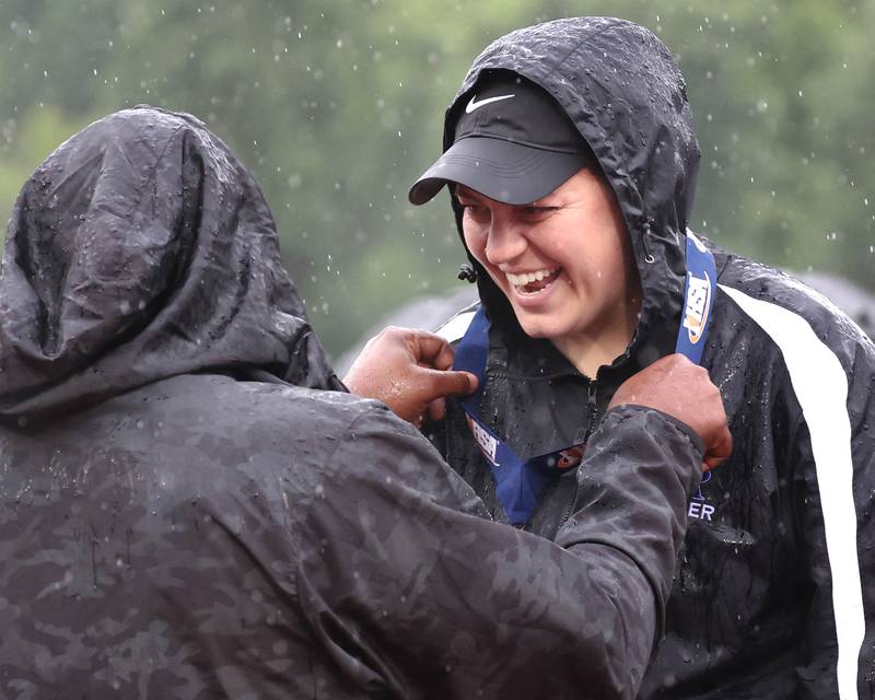 Burlington Central head coach Jessica Arneson accepts her state fourth place medal Saturday, June 1, 2024, after their consolation match loss to Peoria Notre Dame at the IHSA Class 2A state soccer finals at North Central College in Naperville.