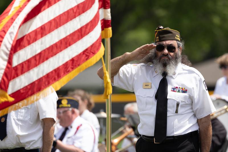 Andy Ruggerio of the Peru Honor Guard salutes flag on Monday, May 26, 2025 at Washington Park in Peru.