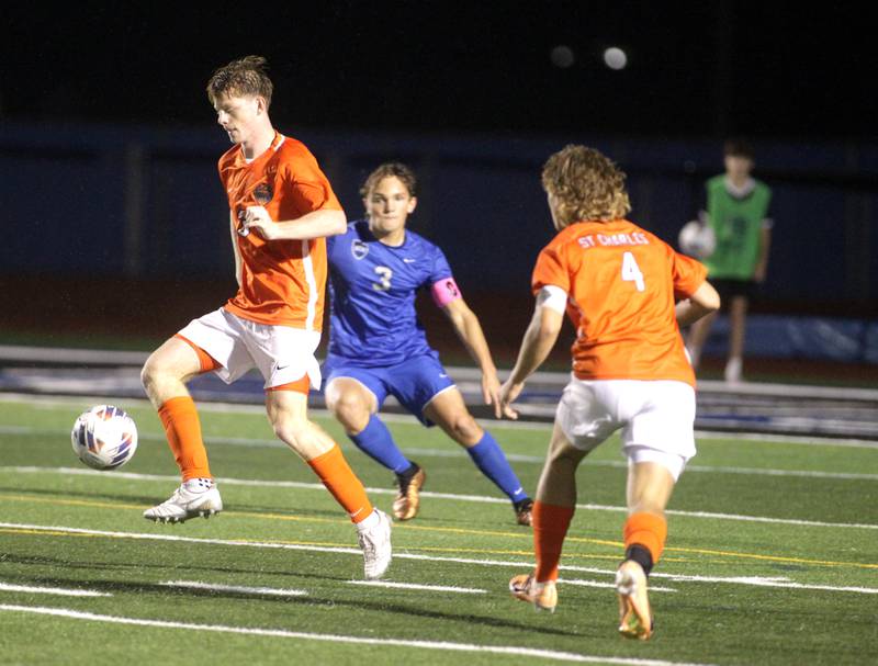 St. Charles East’s Marc Walker gets control of the ball during a Tri-Cities Night game against St. Charles North at St. Charles North on Thursday, Sept. 21, 2023.