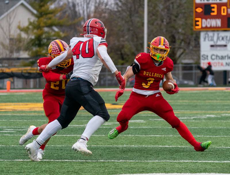 Batavia's Ryan Whitwell (3) runs after the catch against Yorkville's Blake Kersting (40) during a 7A quarterfinal playoff football game at Batavia High School on Saturday, Nov 12, 2022.