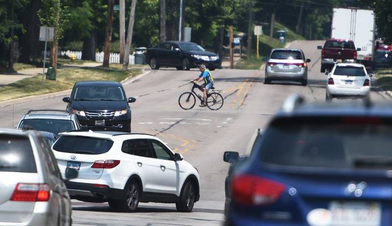 A bicyclist crosses Route 31 at Houston Street in downtown Batavia last week. Statewide, motor vehicle collisions with bicycles increased 8% in 2022 over the previous year. Paul Valade/Daily Herald Media Group