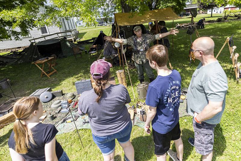 World War II historian Mike Saltsgaver teaches visitors about the SS Wiking division Saturday, May 16, 2026, in Franklin Grove.