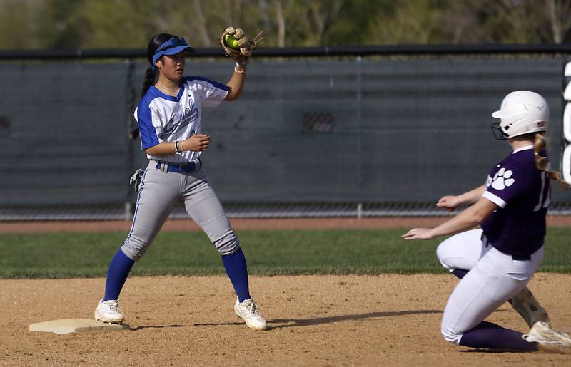 Burlington Central's Mei Shirokawa gets the force out as Hampshire’s Mia Robinson slides into second base during a Fox Valley Conference softball game on Tuesday, April 21, 2026, at Hampshire High School.