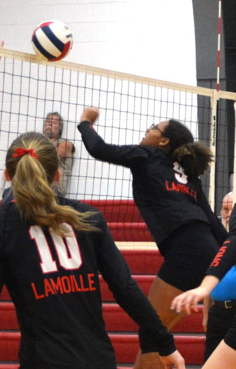 LaMoille's. Olivea Glasper makes a play at the net in Thursday's Senior Night match against Galva. The Lions fell in two games.