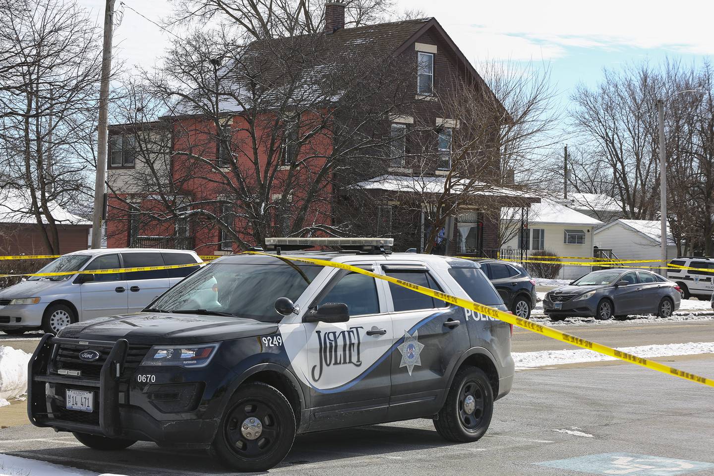 A squad car blocks traffic at the intersection of Ingalls Ave. and Nicholson St. after an officer involved shooting that took place on Thursday, Jan. 28, 2021, in Joliet, Ill.