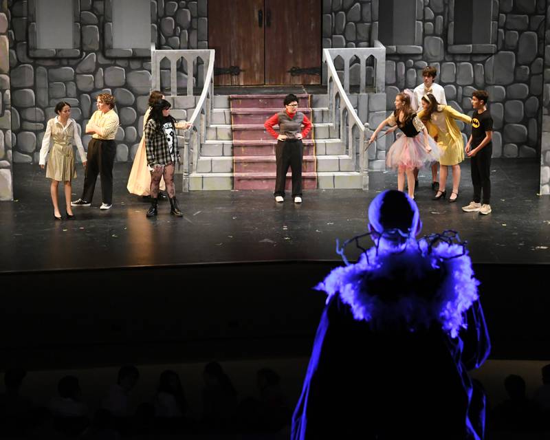 Downers Grove North’s Zac Lanman who plays Mr. Voldy preforms during the production of Puffs  and trys to figure out who stole his shoes during the play on Saturday Nov. 23, 2024, held at Downers Grove North’s High School auditorium.