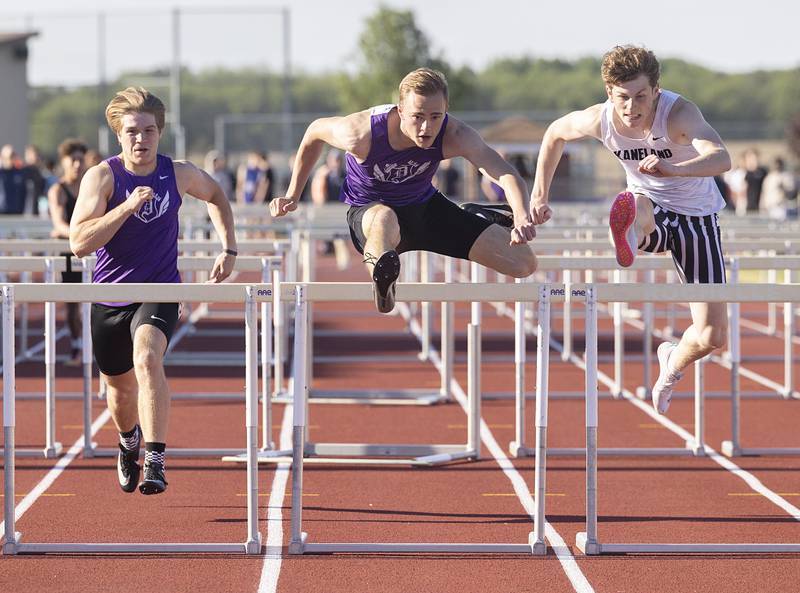 Dixon’s Jayden Toms clears the final hurdle and beats Kaneland’s Brady Mittman in the 110 hurdle Wednesday, May 20, 2026, at the Rochelle Class 2A boys track sectionals.
