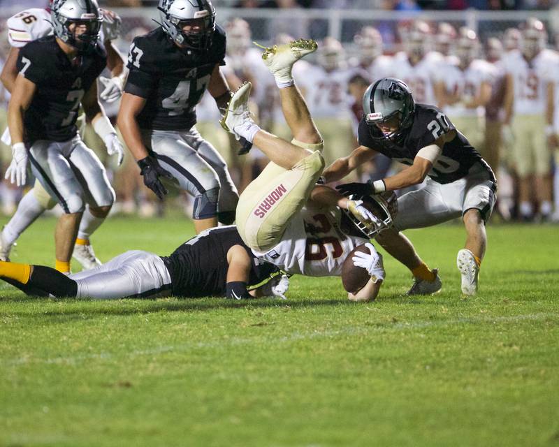 Morris's Jacob Swartz is tackled by Kaneland' defense on Friday, Sept. 8, 2023 in Maple Park.