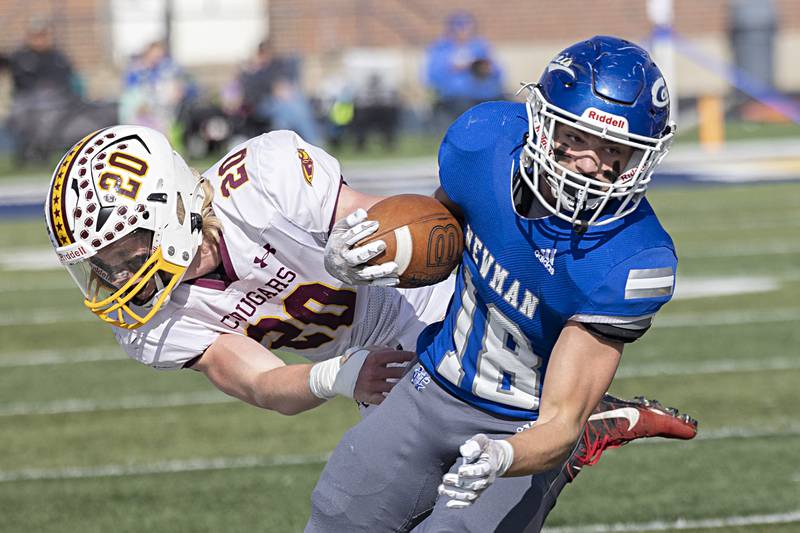 Newman’s Brady Grennan runs the sidelines past ROWVA’sSpencer Brown  Saturday, Oct. 28, 2023 in the Class 1A playoffs in Sterling.