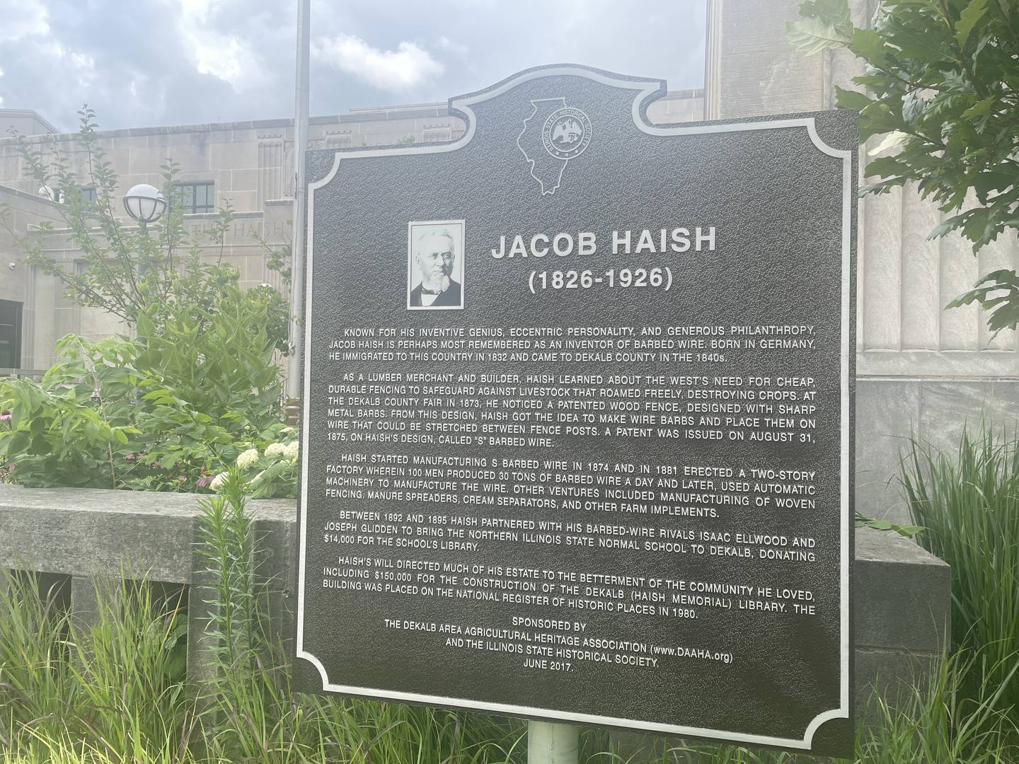 A historical marker honoring Jacob Haish, one of DeKalb's early pioneers is seen July 6, 2024 outside the DeKalb Public Library in DeKalb.