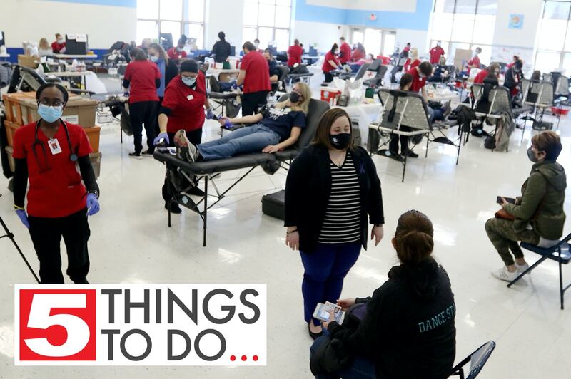 Becki Keltner, center, talks with friends waiting to give blood during the second annual Jake Keltner Memorial Blue Blood Drive on Law Enforcement Appreciation Day, Saturday, Jan. 9, 2021, in Crystal Lake.