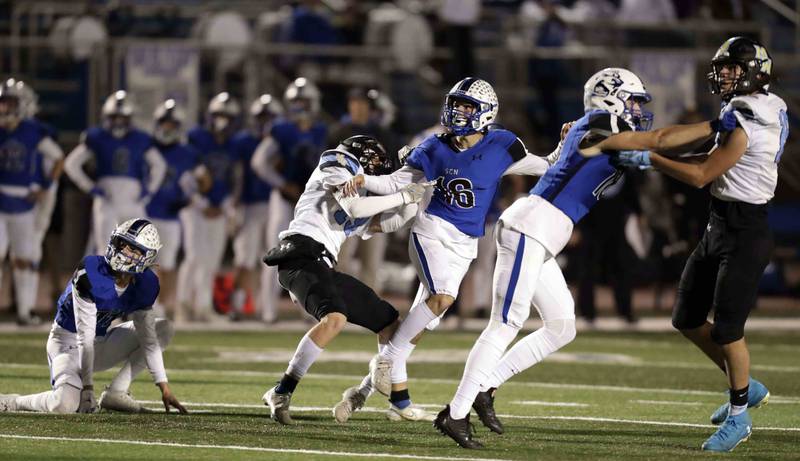 St. Charles North's Hunter Liszka (16) watches his 38 yard field goal Friday October 28, 2022 in St. Charles.