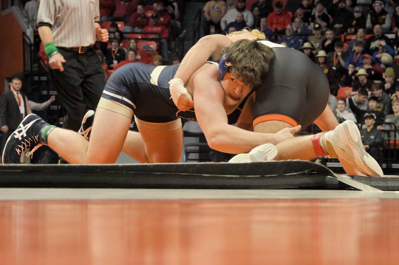 Lemont’s Judah Heeg controls Cayden Parks of Crystal Lake Central in the Class 2A 190-pound final at the IHSA boys state wrestling championships at the State Farm Center in Champaign on Saturday, Feb. 22, 2025.