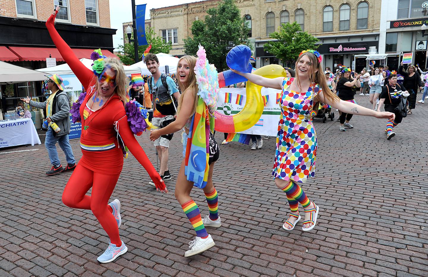 Vicki, Gigi and Jayley Clark dance during the Woodstock PrideFest Parade Sunday, June 12, 2022, around the historic Woodstock Square. The parade, that is its third year, featured over 50 entries for the crowd of around 4,000 people to enjoy, according to city officials.