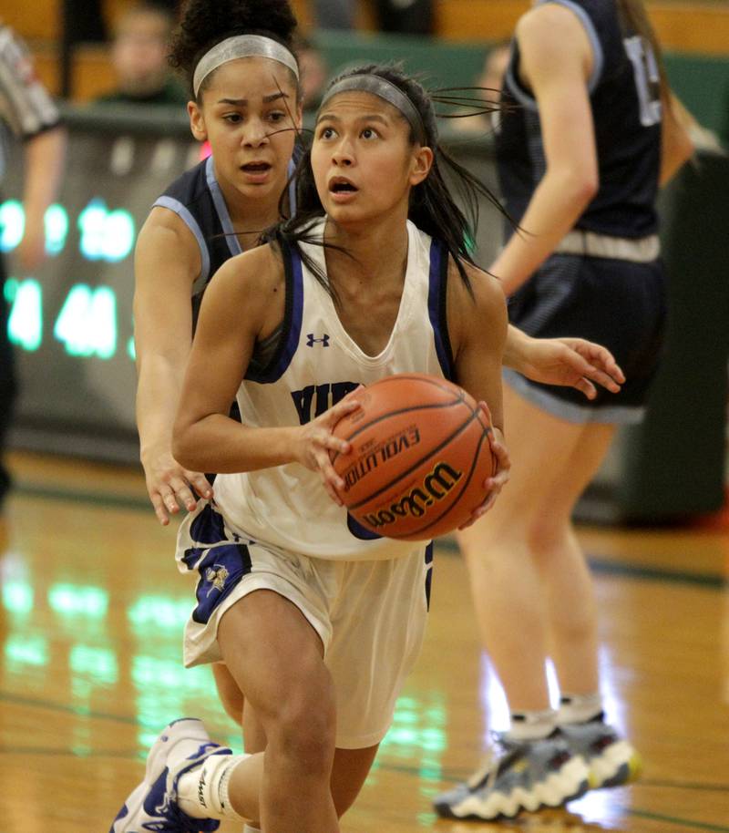 Geneva’s Rilee Hasegawa looks for an opening during a Class 4A Glenbard West Sectional semifinal game against Lake Park in Glen Ellyn on Tuesday, Feb. 21, 2023.