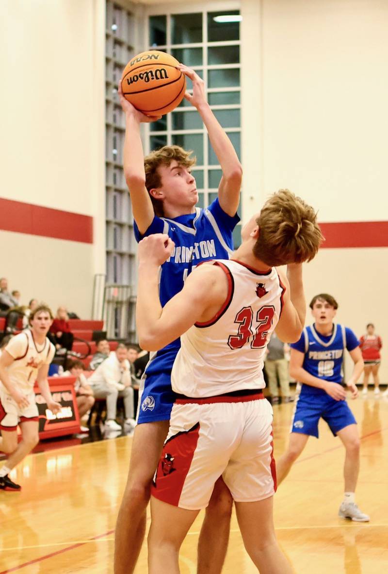 Princeton's Jackson Mason shoots over Halls Chase Sterling at the Colmone Classic on Friday night.