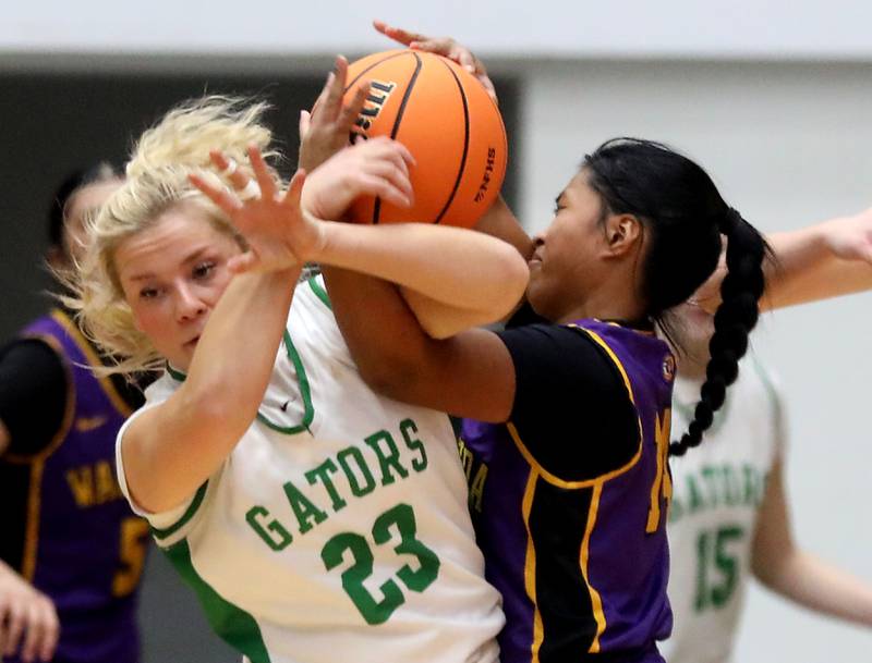 Crystal Lake South's Laken LePage (left) battles with Wauconda's Alexia Manalo for control of the ball during the Northern Illinois Holiday Classic Championship girl basketball game on Thursday, Dec. 18, 2025, at McHenry High School.
