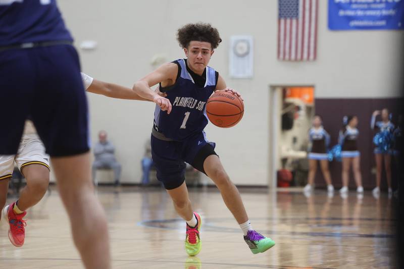 Plainfield South’s Jeremiah Huerta makes a move against Joliet Catholic on Wednesday, Jan. 17th, 2024 in Joliet.