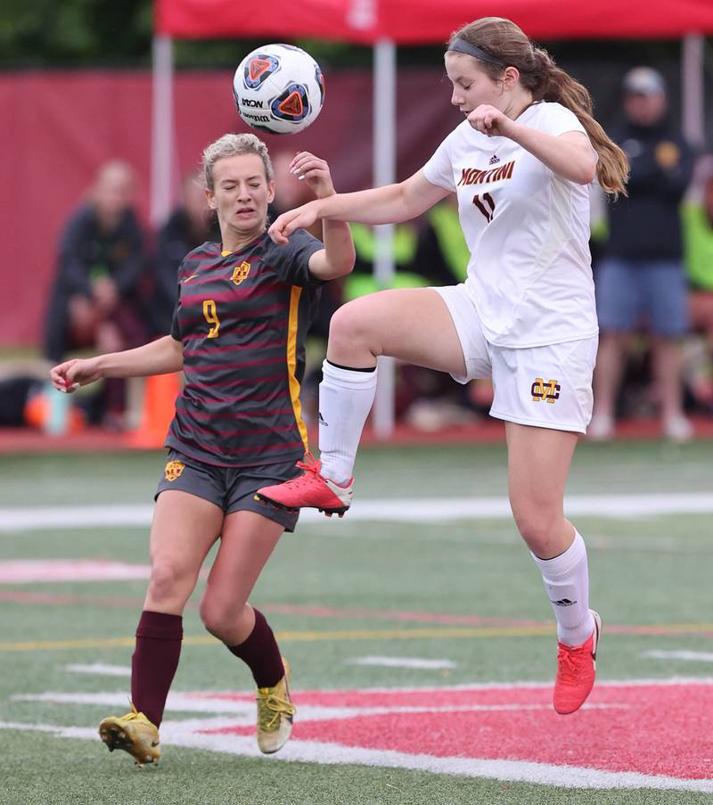 Richmond-Burton's Reese Frericks (left) and Montini's Riley White try to win possession Friday, May 27, 2022, during their IHSA Class 1A state semifinal game at North Central College in Naperville.