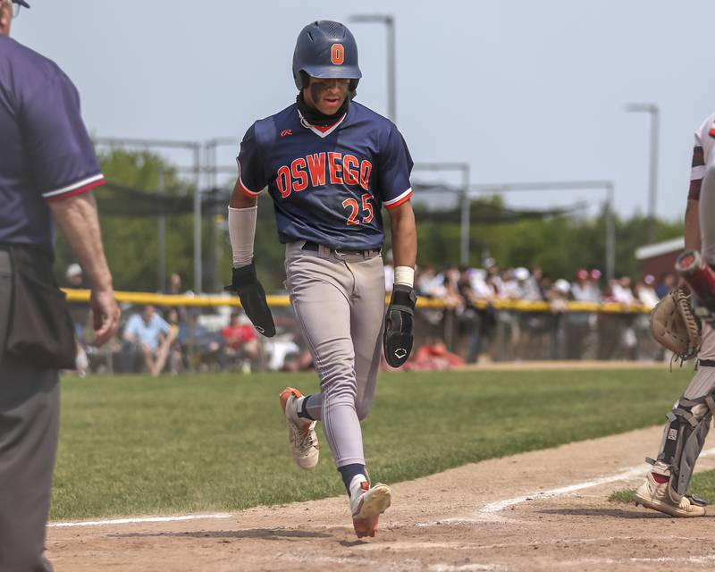 Oswego's Kam Jenkins (25) scores a run during Class 4A Plainfield North Regional final baseball game between Oswego at Plainfield North. Saturday, May 31, 2025 in Plainfield.