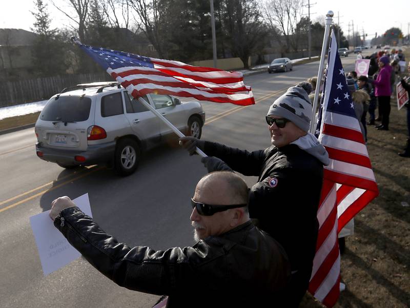 Jimmy Colantoni and Chris Wilder, both of Cary, protest during a Cary School District 26 anti-mask rally Tuesday, Feb. 15, 2022, along Three Oaks Road at Cary-Grove Park. The event was attend by about 100 people and organized by the Illinois Parents Union Cary.