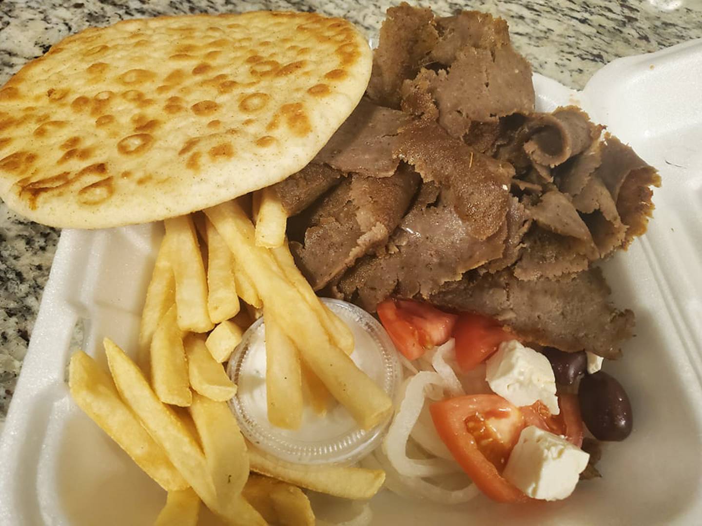 The gyro platter duo at Johnny’s Beef & Gyros in Joliet came with gyro meat, warm pita bread, cucumber (tzatziki) sauce, onion, tomato, feta cheese, kalamata olives, fries and cole slaw.