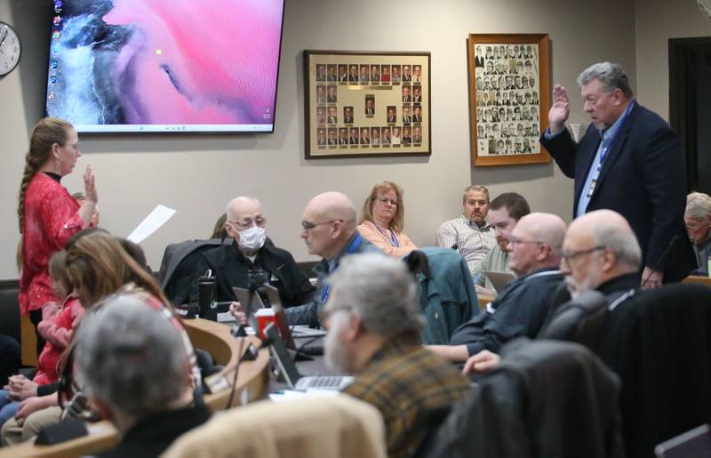 La Salle County Board member James Reid is sworn while taking the oath from La Salle County Clerk Jen Ebner during the La Salle County Board Meeting on Thursday, Feb. 13, 2025 at the La Salle County Government Center in Ottawa. Reid replaces Beth Finley Smith in the District 4 seat.