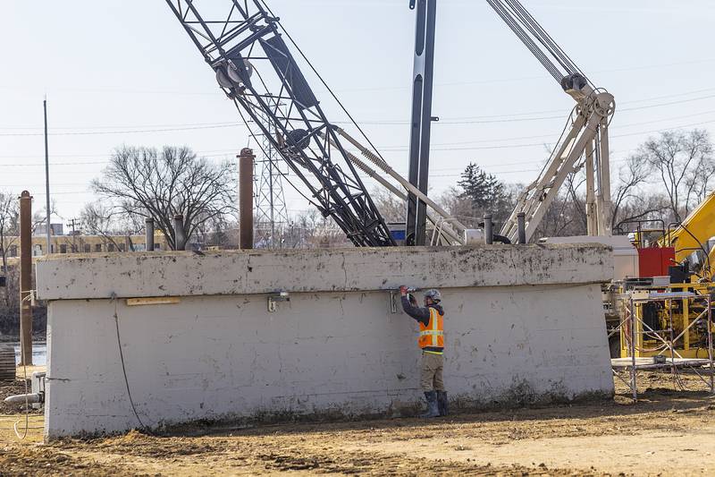 Work is done on one of the railroad pylons Tuesday, March 11, 2025, for Project Rock.