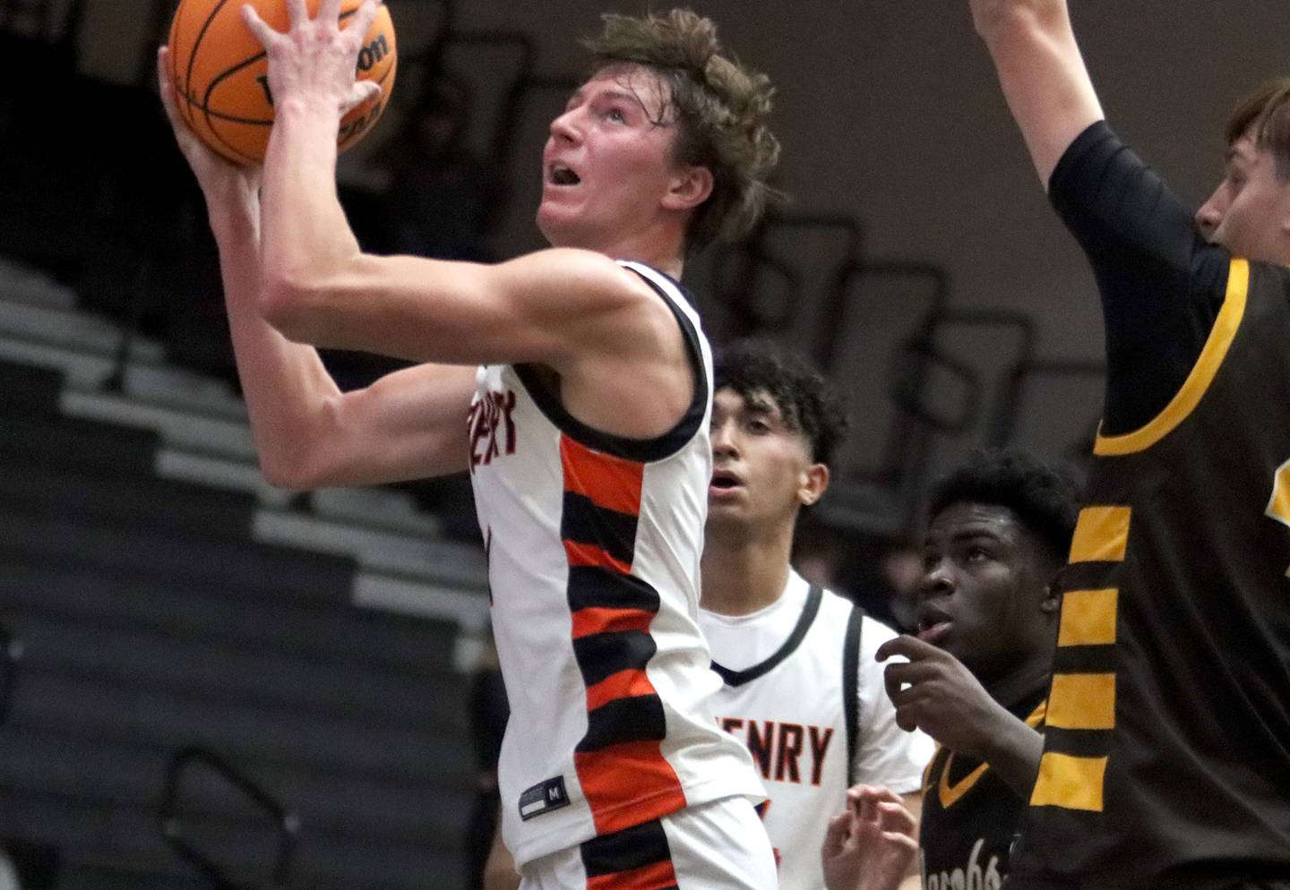 McHenry’s Dylan Hurckes works under the hoop against Jacobs in varsity basketball on Wednesday, Dec. 4, 2024 at McHenry High School in McHenry.