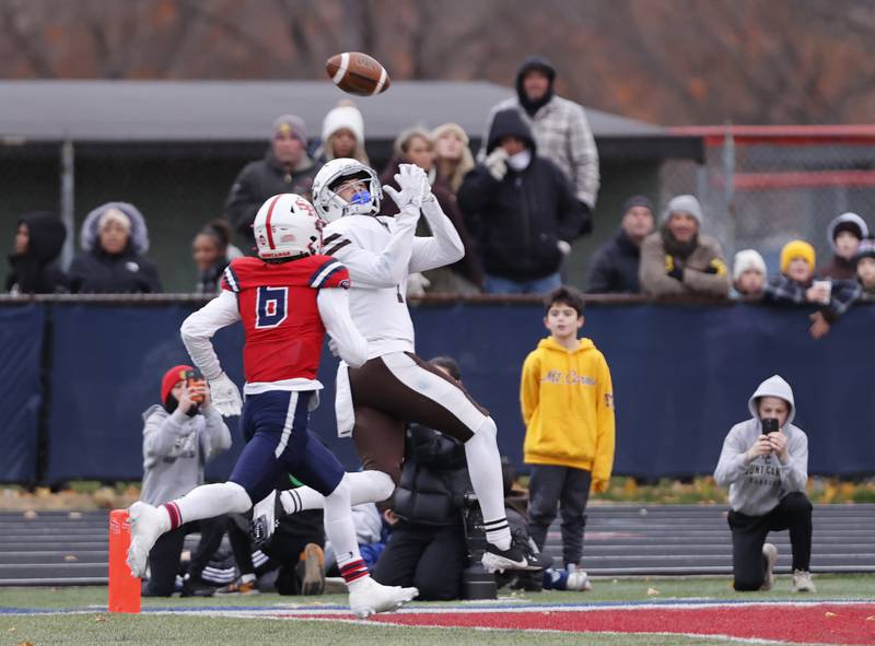 Mt. Carmel's Quentin Burell (4) makes a touchdown reception during the class 7A semi-final playoff game between Mt. Carmel and St. Rita high schools on Saturday, Nov. 23, 2024 in Chicago.