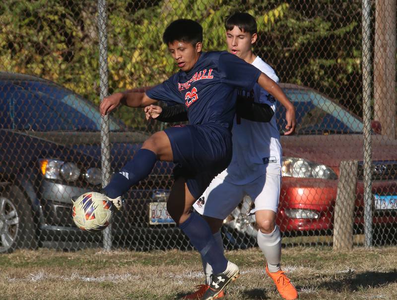 DePue/Hall's Nery Yaxcal kicks the ball around Earlville's Juan Vazquez during the Class 1A Regional quarterfinal game on Wednesday, Oct. 16, 2024 in DePue.
