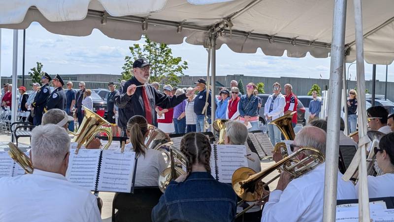 Michael A. Orenic directs the Frankfort Brass Band at the city of Crest Hill Veterans/Police Memorial Committee's annual Memorial Day observance on Monday, May 26, 2025, at the Crest Hill Veterans/Police Memorial Garden.