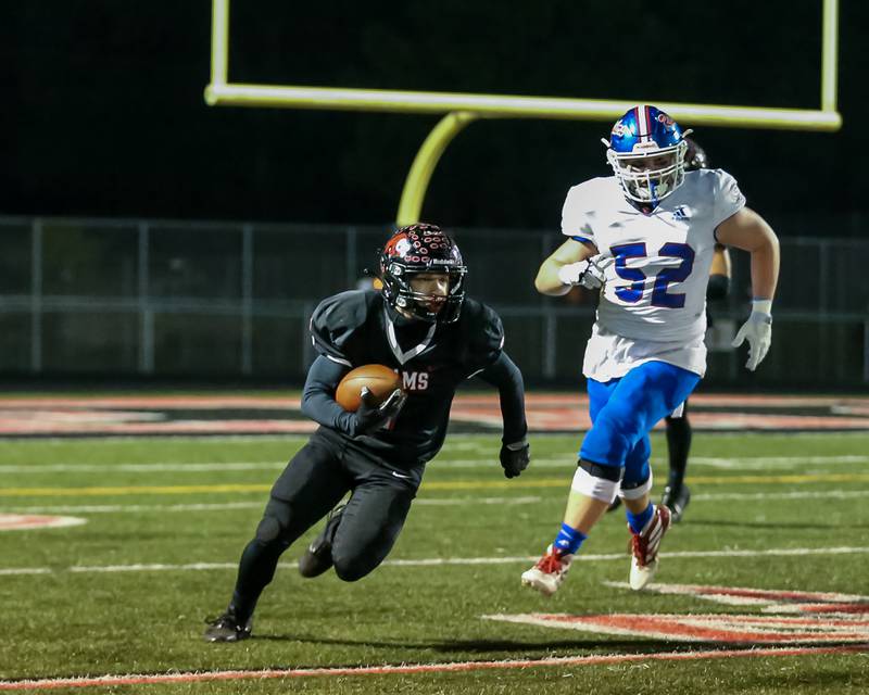 Glenbard East's Matthew Larson (1) takes off with the ball during football game between Glenbard South at Glenbard East.   Oct 13, 2023.