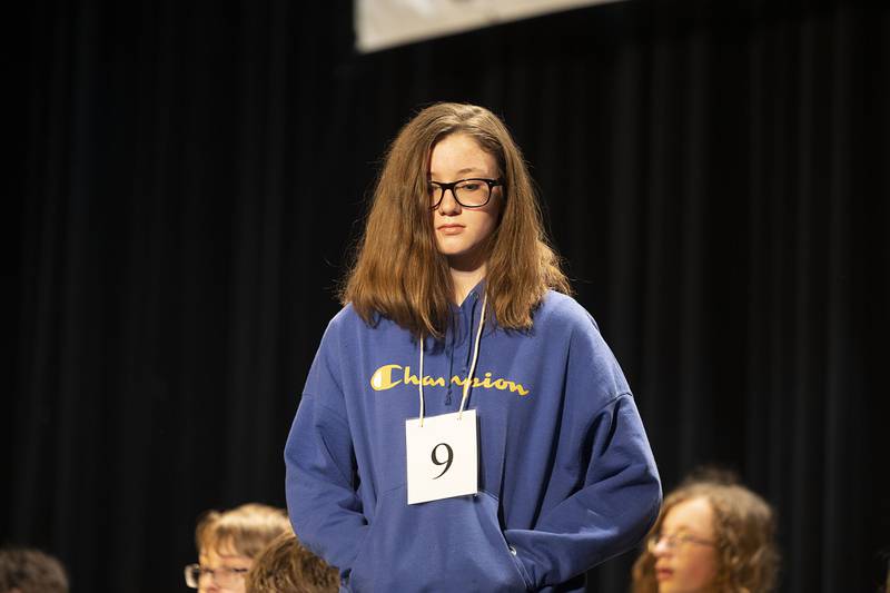 Aplington Middle School seventh grader Aubrey Herndon appears on stage Thursday, March 9, 2023 during the Lee-Ogle-Whiteside Regional Spelling Bee.