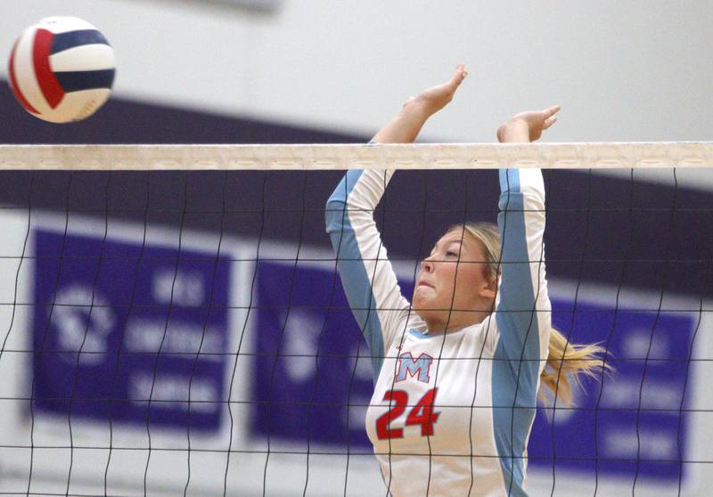 Marian Central’s Caroline Conner blocks against Genoa-Kingston in varsity volleyball tournament action on Saturday, Sept. 21, 2024, at Hampshire High School in Hampshire.