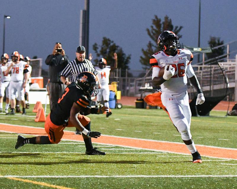 Edwardsville star running back Justin Johnson Jr. (26) runs in for a touchdown during the Tigers' 2019 victory over DeKalb.