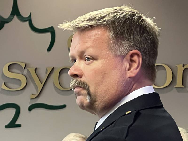 Bart Gilmore stands while Sycamore Fire Chief Pete Polarek introduces him to the Sycamore City Council on Sept. 19, 2022.