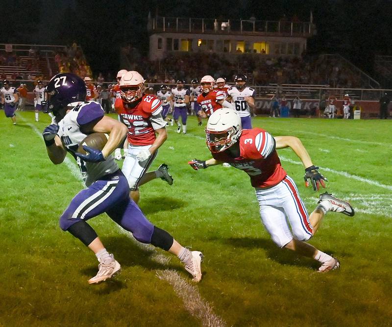 Dixon's Eli Davidson runs the ball up the sideline while being trailed by Oregon's Gabe Eckerd and Jayden Jenkins Friday, Aug. 26, 2022.