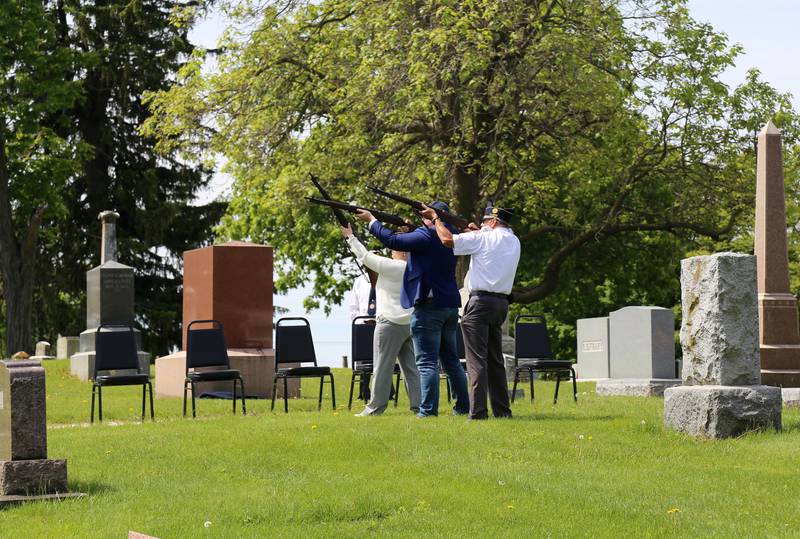 Joann Gabl, Tyler Lawrence and John Waynick perform a Rifle Detail at the Elburn American Legion Annual Memorial Day Observance at the Blackberry Township Cemetery on Monday, May 26, 2025.