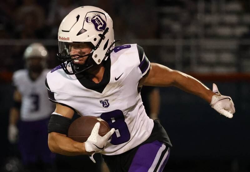 Dixon's Tyson Dambman carries the ball against Genoa-Kingston during their game Friday, Sept. 20, 2024, at Genoa-Kingston High School.