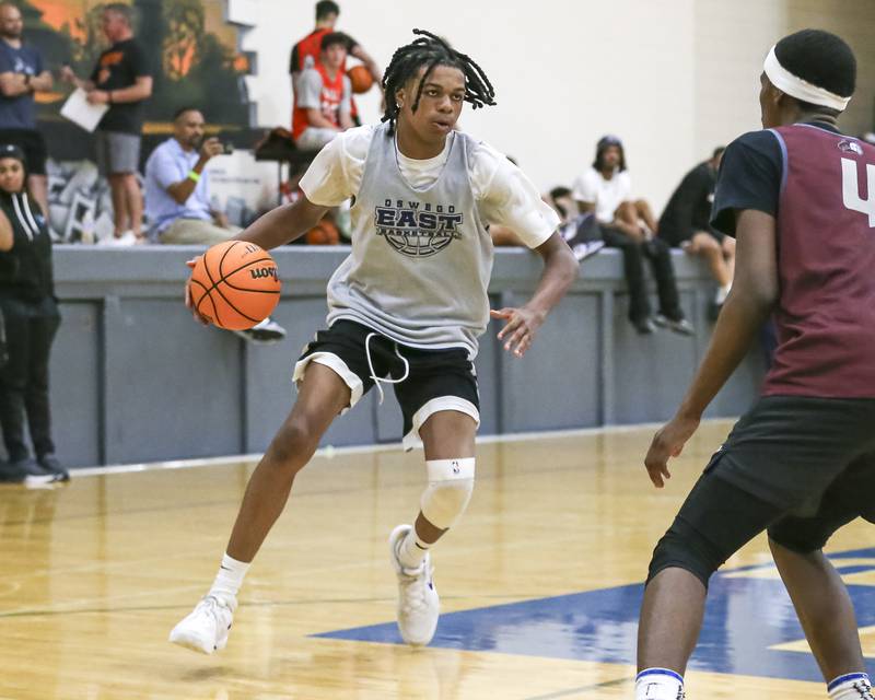 Oswego East's Mason Lockett handles the ball in their Riverside-Brookfield Shootout basketball game.  June 20, 2025 in Riverside.