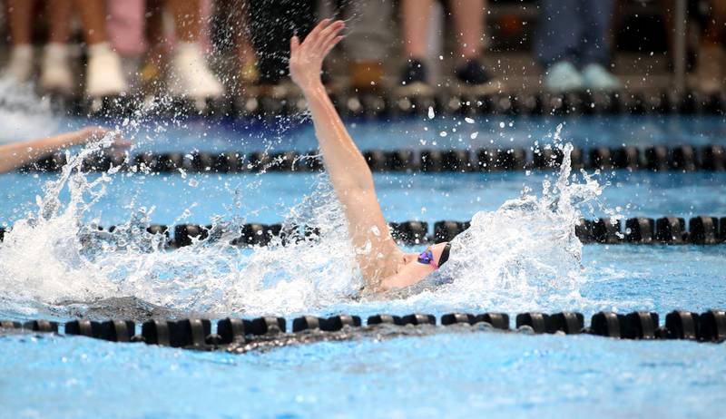St. Charles North’s Thea Bike competes in the 100-yard backstroke championship heat during the IHSA Girls State Championships on Saturday, Nov. 16, 2024 at FMC Natatorium in Westmont.