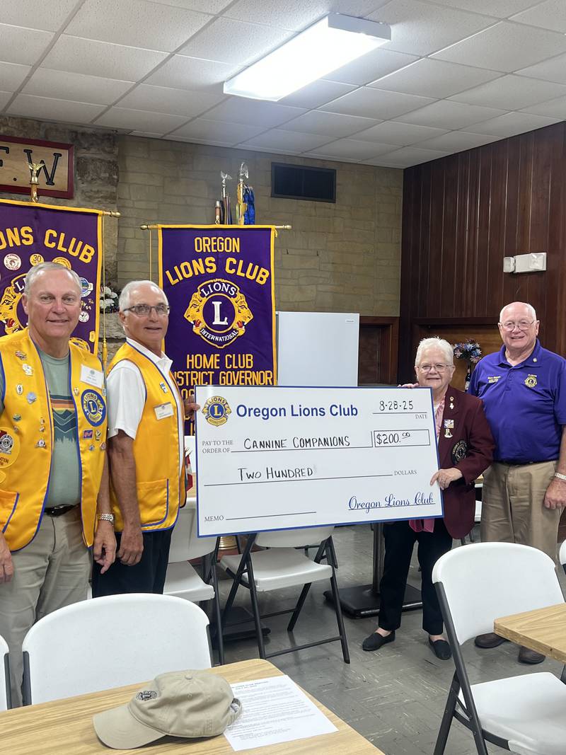 Pictured left to right: Vice President Mike Hoff, President Grant Afflerbaugh, District Governor Marcia Meyers and Chaplain for the Lena Lions Club Gary Meyers.