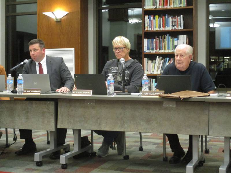 Yorkville School District Y115 Associate Superintendent Nick Baughman speaks to the school board at the Oct. 25, 2022 meeting as board members Robert Brenart, center, and Tom Kozlowicz listen.