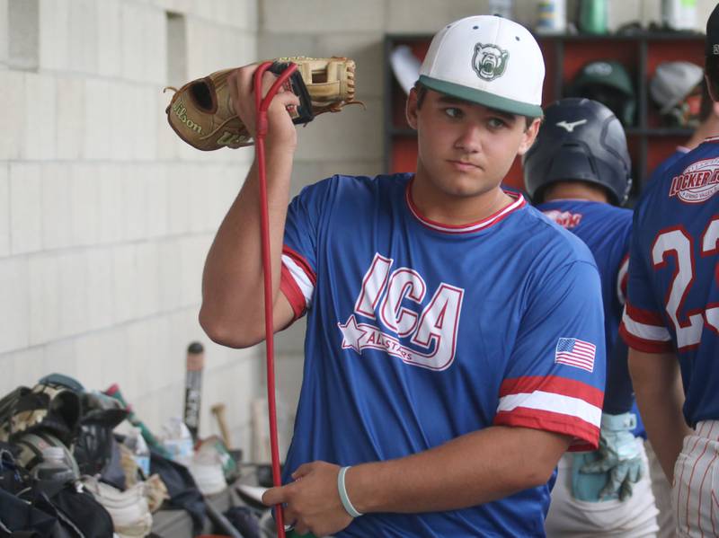 St. Bede's Alan Spencer grabs his gear in the dugout during the ICA Senior Baseball All Star Game on Monday, June 30, 2025 at Schweickert Stadium in Peru.