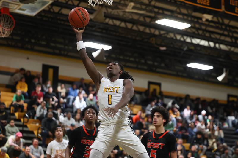Joliet West’s Justus McNair lays a shot against Plainfield East on Friday, Dec. 8th, 2023 in Joliet.