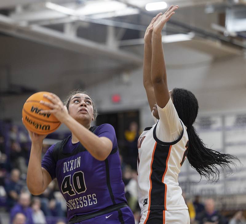 Dixon's Hallie Williamson looks to put up a shot against Byron’s Malia Morton Friday, Dec. 27, 2024, during the Dixon Girls KSB Holiday Basketball Classic.