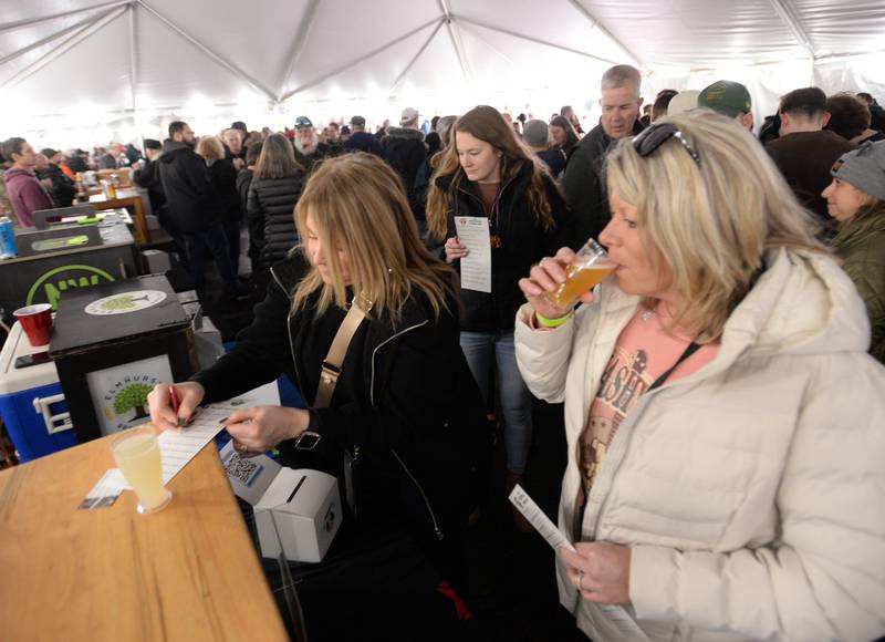 Westmont Winter Beer Festival participants (left) Pam Closset of Naperville and Denice Michalek of Darien try the lemon seltz-up  Saturday Feb 18, 2023.