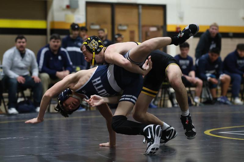 Joliet West’s Casey Koerner drops Plainfield South’s Allen Cortez in the 106 pound match on Wednesday, Dec. 3, 2025 in Joliet.